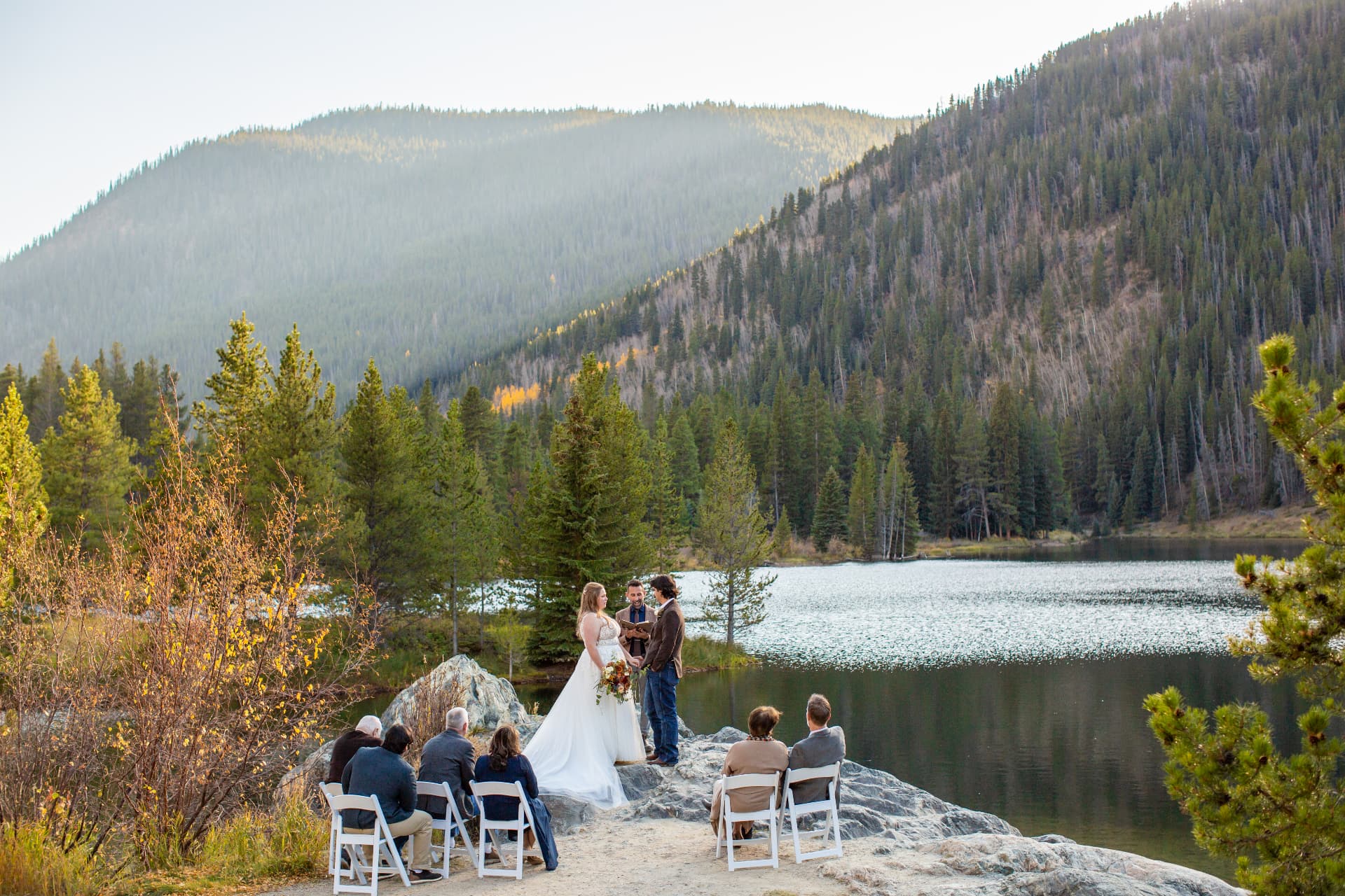 A couple's small wedding ceremony beside a Colorado alpine lake